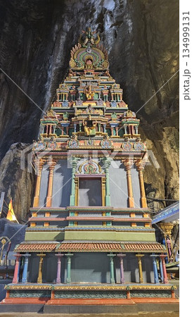 A vibrant Hindu temple bursts with color and sacred detail inside a cave A vibrant Hindu temple bursts with color and sacred detail inside a cave 134999131