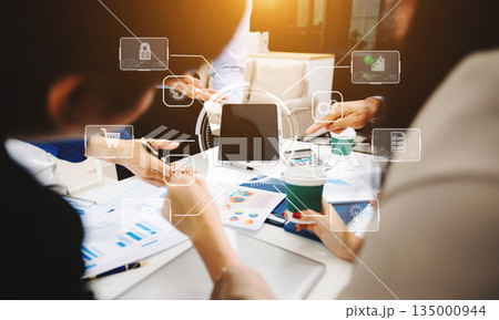 Working team meeting concept, business using laptop and smart phone and digital tablet computer with digital marketing media  in virtual icon network diagram 135000944