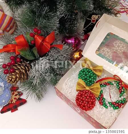 Handmade beaded  Christmas ornament in box. Top view 135001591