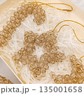 Handmade beaded Christmas ornament made of transparent brown color 135001658