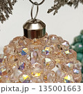 Handmade beaded Christmas ball. Cropped photo 135001663