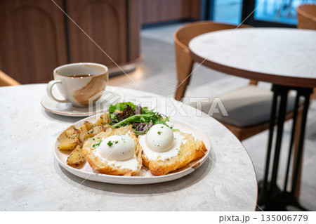 Eggs Benedict breakfast in a restaurant. Eggs Benedict breakfast in a restaurant. 135006779