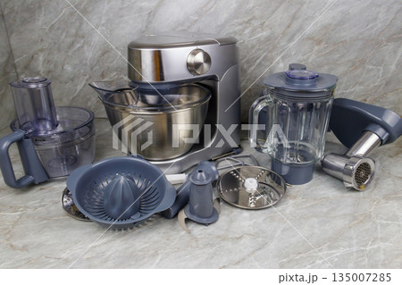 Modern kitchen machine with different attachments and accessories Modern kitchen machine with different attachments and accessories 135007285