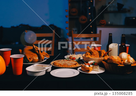 Friends enjoying a Halloween party at a bar making a toast 135008285