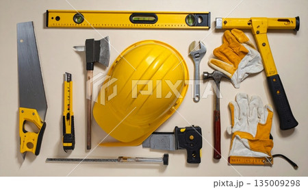 A professional industrial worker wears a yellow hard hat and uses safety equipment on a building site to ensure protection during engineering and construction work A professional industrial worker wears a yellow hard hat and uses safety equipment on a building site to ensure protection during engineering and construction work 135009298