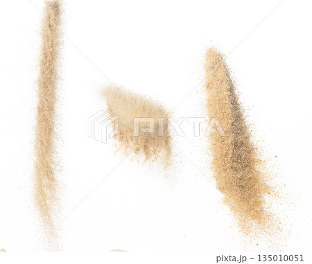 Sand flying explosion, Golden sand wave explode. Abstract sands cloud fly. Yellow colored sand splash throwing in Air. White background Isolated high speed shutter, throwing freeze stop motion Sand flying explosion, Golden sand wave explode. Abstract sands cloud fly. Yellow colored sand splash throwing in Air. White background Isolated high speed shutter, throwing freeze stop motion 135010051