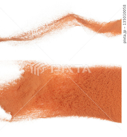 brick Sand flying explosion, ground sands grain wave explode. Abstract cloud fly. Orange colored sand splash throwing in Air. White background Isolated high speed shutter, throwing freeze 135010058