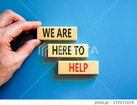 Support, help and we are here to help symbol. Concept words We are here to help on beautiful wooden blocks. Beautiful blue background. Business we are here to help concept. Copy space. 135011029