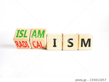 Islamism or radicalism symbol. Concept words Islamism or Radicalism on beautiful wooden cubes. Beautiful white table white background. Business islamism or radicalism concept. Copy space 135011057