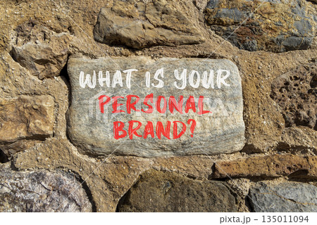 What is your personal brand symbol. Concept words What is your personal brand on beautiful grey stone. Beautiful stone wall background. Business what is your personal brand concept. Copy space. 135011094