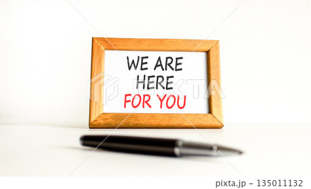 Support, help and we are here for you symbol. Concept words We are here for you on beautiful wooden picture frame. Beautiful white background. Business we are here for you concept. Copy space. Support, help and we are here for you symbol. Concept words We are here for you on beautiful wooden picture frame. Beautiful white background. Business we are here for you concept. Copy space. 135011132