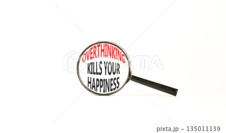 Overthinking kills your happiness symbol. Concept words Overthinking kills your happiness on magnifying glass. Beautiful white background. Business overthinking kills happiness concept. Copy space. 135011139