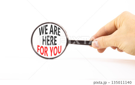 Support, help and we are here for you symbol. Concept words We are here for you on beautiful magnifying glass. Beautiful white background. Business we are here for you concept. Copy space. 135011140