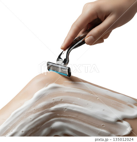 Woman's hand shaving a lathered leg with a modern razor, representing daily personal hygiene, grooming, and hair removal routines 135012024