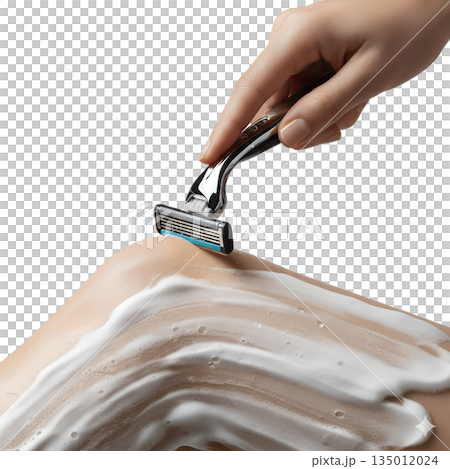 Woman's hand shaving a lathered leg with a modern razor, representing daily personal hygiene, grooming, and hair removal routines 135012024