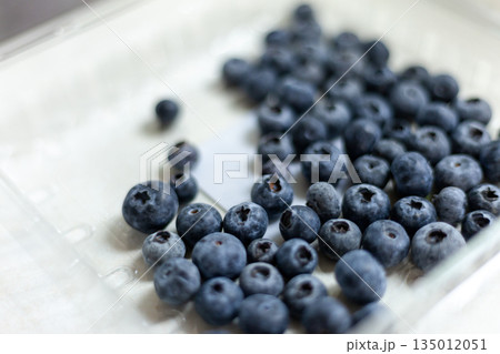 Blueberries fruit in a market plastic container 135012051