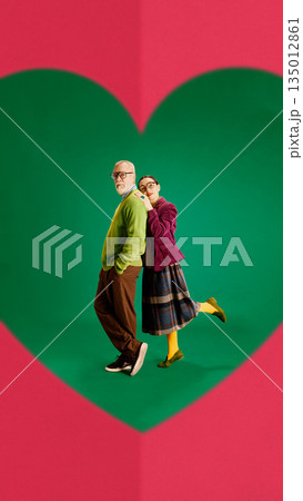 Modern artwork of mature couple standing inside heart shape. Modern artwork of mature couple standing inside heart shape. 135012861