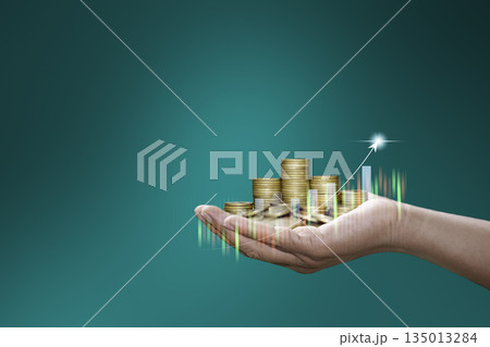 Hand holding stacked coins with rising chart and glowing arrow, representing financial growth, investment success, and economic prosperity. Hand holding stacked coins with rising chart and glowing arrow, representing financial growth, investment success, and economic prosperity. 135013284