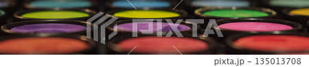 Abstract macro close-up of a colorful makeup or artist paint palette with shallow depth of field. Symbolize creativity, art, and cosmetics Abstract macro close-up of a colorful makeup or artist paint palette with shallow depth of field. Symbolize creativity, art, and cosmetics 135013708