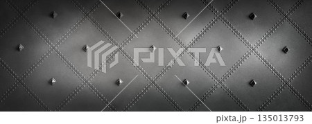 Quilted black metal surface with pyramid rivets Quilted black metal surface with pyramid rivets 135013793