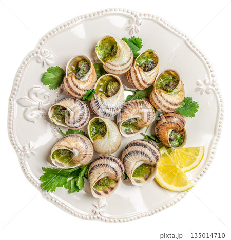 Baked escargots snails with garlic herb butter and lemon served on white plate isolated on white background, top view Baked escargots snails with garlic herb butter and lemon served on white plate isolated on white background, top view 135014710