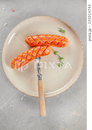 Grilled sausages on plate with herbs, top view, copy space Grilled sausages on plate with herbs, top view, copy space 135014743