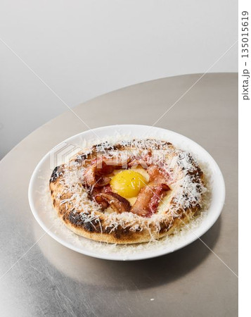 Gourmet ham and egg pastry displayed on minimalist dish Gourmet ham and egg pastry displayed on minimalist dish 135015619
