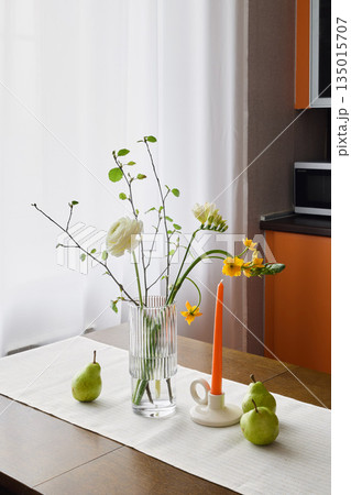 food bloggers floral centerpiece with pears on dining table 135015707