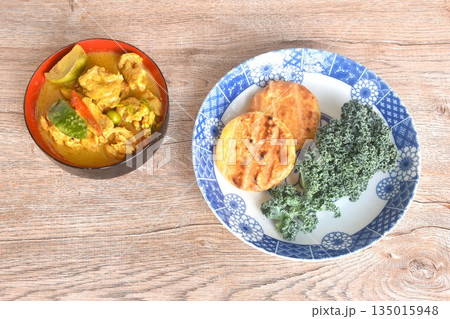 spicy boiled slice pork eggplant in curry soup eat couple grilled sticky rice with egg and curly kale vegetable on plate spicy boiled slice pork eggplant in curry soup eat couple grilled sticky rice with egg and curly kale vegetable on plate 135015948