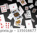 A dynamic mid-air scatter of playing cards. 135016677