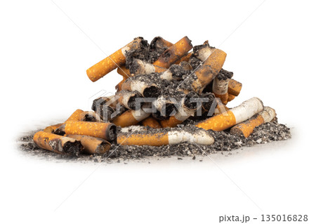 pile of cigarette butts and ash on a white background 135016828