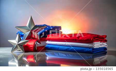 Patriotic American Flag Colors Folded Fabric and Silver Stars with Soft Sunset Light Backdrop Studio. 135018565