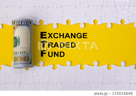 Etf exchange traded fund concept with money and puzzle 135018849