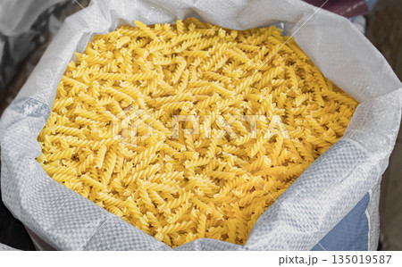 Bulk pasta at a grocery supermarket, dry bulk pasta at a grocery store 135019587