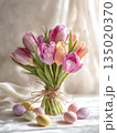 fresh tulip bouquet and easter eggs on the table, generative ai 135020370