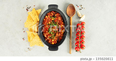Mexican Chili Con Carne with Corn Chips, Peppers, and Tomatoes Mexican Chili Con Carne with Corn Chips, Peppers, and Tomatoes 135020811