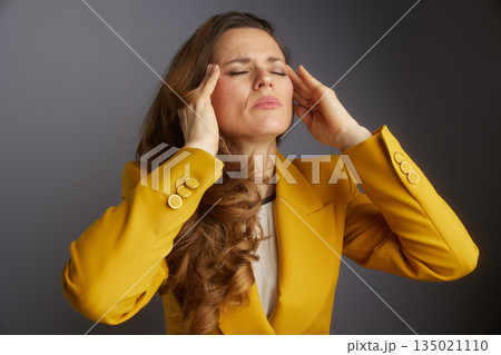 Business Executive Enduring a Stress Headache Business Executive Enduring a Stress Headache 135021110