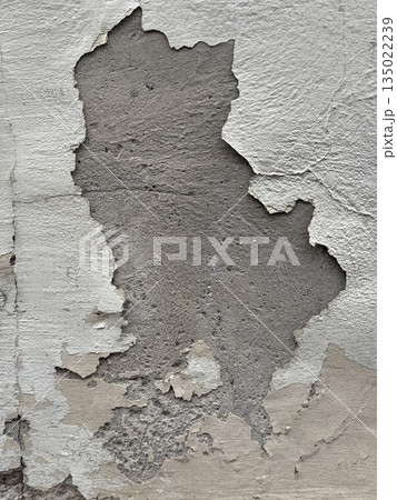 Peeling paint texture on weathered concrete wall showing signs of age and decay, perfect background 135022239