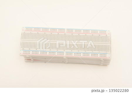 A solderless board for electronics. A breadboard for experiments in electronics. 135022280