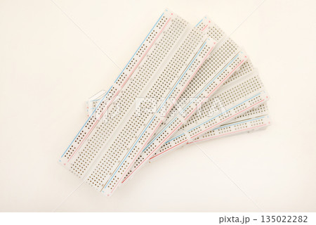 A solderless board for electronics. A breadboard for experiments in electronics. 135022282