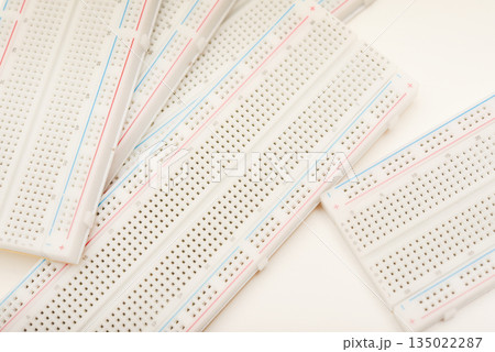 A solderless board for electronics. A breadboard for experiments in electronics. A solderless board for electronics. A breadboard for experiments in electronics. 135022287