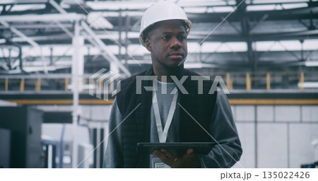 Technical Supervisor in Protective Hard Hat Audits System Performance With Tablet Technical Supervisor in Protective Hard Hat Audits System Performance With Tablet 135022426