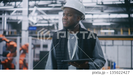 Critical Process Monitoring, Manager Analyzing Metrics on Handheld Device Critical Process Monitoring, Manager Analyzing Metrics on Handheld Device 135022427