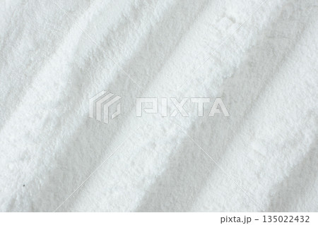 White sodium bicarbonate powder macro background White sodium bicarbonate powder macro background 135022432