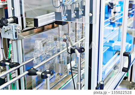 Plastic bottles in filling machine 135022528