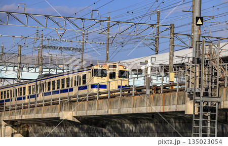 Local train travels over a bridge in Kitakyushu, Fukuoka Japan. Local train travels over a bridge in Kitakyushu, Fukuoka Japan. 135023054