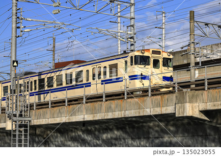 Local train travels over a bridge in Kitakyushu, Fukuoka Japan. 135023055