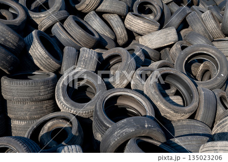 Chaotic Pile Of Discarded Car Tires Waiting For Reuse Or Recycling Chaotic Pile Of Discarded Car Tires Waiting For Reuse Or Recycling 135023206
