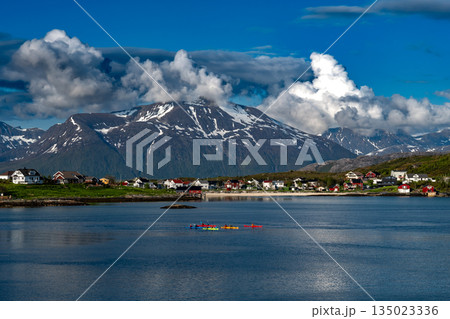 Kayaks At The Atlantic Coast, Cottages, Calm Fjord And Snowy Mountains On Sommaroy Island In Norway 135023336