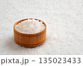 Salt crystals in a wooden bowl close-up 135023433